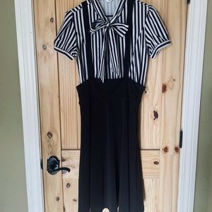 Women’s black pinafore dress with black and white top
